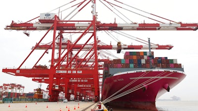 In this photo released by Xinhua News Agency, a container ship from Japan is anchored at the container dock of Shanghai's Yangshan Port in east China on April 27, 2022. China’s trade growth rebounded in May after anti-virus restrictions that shut down Shanghai and other industrial centers began to ease, according to a customs agency statement on Thursday, June 9, 2022.