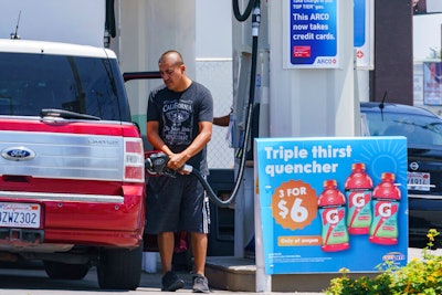 A motorist pumps gasoline at an ARCO gas station in Los Angeles, Sunday, June 12, 2022. Soaring gasoline prices have left many consumers with no choice but to cut spending on non-essentials, but it might be coming full circle by stopping some drivers from filling up their tanks.