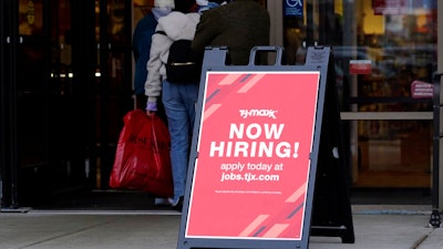 Hiring sign is displayed outside of a retail store in Vernon Hills, Ill., on Nov. 13, 2021. Fewer Americans applied for jobless aid last week with the number of Americans collecting unemployment at historically low levels. Applications for unemployment benefits fell by 11,000 to 200,000 for the week ending May 28, the Labor Department reported Thursday, June 2, 2022. First-time applications generally track the number of layoffs.