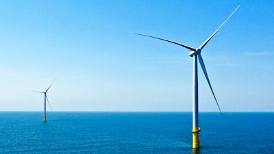 Two of the offshore wind turbines which have been constructed off the coast of Virginia Beach, Va. are seen on June 29, 2020. The White House is launching a formal partnership with 12 East Coast governors to boost the growing offshore wind industry. It's a key element of President Joe Biden's plan for climate change.