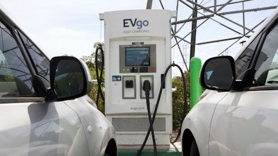 Electric cars are parked at a charging station in Sacramento, Calif., on April 13, 2022. General Motors, Pilot Travel Centers and EVgo said Thursday, July 14, 2022, that they will build 2,000 charging stalls at “up to” 500 Pilot Flying J sites across the nation. GM says construction will start this summer with the first direct current fast chargers operating sometime in 2023.