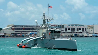 In this image provided by the U.S. Navy, a Sea Hunter, a crewless vessel, arrives at Pearl Harbor, Hawaii, to participate in the Rim of Pacific (RIMPAC) 2022, on June 29, 2022. The Navy is expediting development of drone ships aimed at expanding the reach of offensive firepower while keeping sailors on traditional warships farther from harm's way.