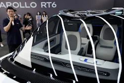 Xu Baoqiang, general manager of Baidu Autonomous Driving Vehicle manager, briefs members of the media on the Apollo RT6, a fully electric vehicle with an 'optional' steering wheel that can be removed or installed when required, Wednesday, July 20, 2022, in Beijing. Chinese search engine and artificial intelligence firm Baidu on Thursday, July 21 unveiled its latest electric autonomous driving vehicle that it says will be soon be part of its robotaxi fleet, as China pushes forward with its autonomous driving ambitions.