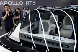 Xu Baoqiang, general manager of Baidu Autonomous Driving Vehicle manager, briefs members of the media on the Apollo RT6, a fully electric vehicle with an 'optional' steering wheel that can be removed or installed when required, Wednesday, July 20, 2022, in Beijing. Chinese search engine and artificial intelligence firm Baidu on Thursday, July 21 unveiled its latest electric autonomous driving vehicle that it says will be soon be part of its robotaxi fleet, as China pushes forward with its autonomous driving ambitions.