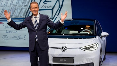 In this Monday, Sept. 9, 2019, file photo, CEO of Volkswagen Herbert Diess introduces the new VW ID.3 at the IAA Auto Show in Frankfurt, Germany. Volkswagen has announced that the CEO of the German automaker is stepping down. The company said Friday that Herbert Diess will depart as of Sept. 1 “by mutual consent” with the board. His contract was set to expire in 2025.