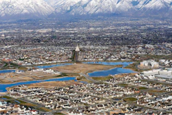 Homes in suburban Salt Lake City are shown, April 13, 2019. According to a new study released Monday, July 25, 2022, by the U.S. Census Bureau, by age 26 more than two-thirds of millennials lived in the same general area where they grew up, 80% had moved less than 100 miles away and 90% resided less than 500 miles away.