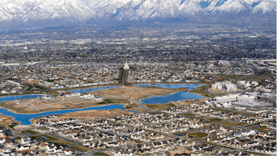 Homes in suburban Salt Lake City are shown, April 13, 2019. According to a new study released Monday, July 25, 2022, by the U.S. Census Bureau, by age 26 more than two-thirds of millennials lived in the same general area where they grew up, 80% had moved less than 100 miles away and 90% resided less than 500 miles away.