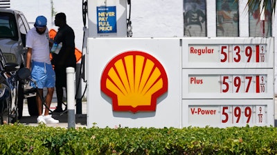 Consumers fill up at a Shell gas station July 13, 2022, in Miami Beach, Fla. Energy giant Shell has posted record profits for a second straight quarter as the company continues to benefit from the soaring price of oil and gas fueled by Russia’s war in Ukraine. London-based Shell said it’s second quarter adjusted earnings rose to $11.5 billion from $5.5 billion in the same three month period last year.