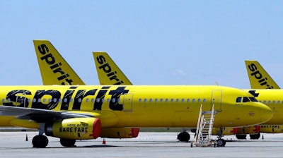 A line of Spirit Airlines jets sit on the tarmac at the Orlando International Airport on May 20, 2020, in Orlando, Fla. JetBlue is buying Spirit Airlines, Thursday, July 28, 2022, in a $3.8 billion deal, a day after Spirit and Frontier Airlines agreed to abandon their merger proposal.