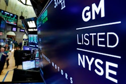 The logo for General Motors appears above a trading post on the floor of the New York Stock Exchange, Monday, April 23, 2018. General Motors will reinstate quarterly dividend payments that were suspended during the pandemic that shut down its factories. The automaker said Friday, Aug. 19, 2022, that the dividend of 9 cents per share will be paid on Sept. 15 to shareholders of record on Aug. 31.