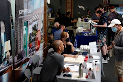 Prospective employers and job seekers interact during during a job fair in West Hollywood, Los Angeles, Sept. 22, 2021.