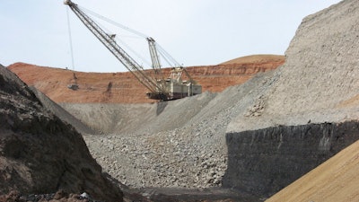In this April 4, 2013, file photo, a dragline excavator moves rocks above a coal seam at the Spring Creek Mine in Decker, Mont. A federal judge has reinstated a moratorium on coal leasing from federal lands that was imposed under former President Barack Obama and then scuttled under former President Donald Trump, Friday, Aug. 12, 2022.