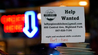 Hiring sign is displayed at a restaurant in Highland Park, Ill., Thursday, July 14, 2022. The number of Americans applying for unemployment benefits last week rose to its highest level in more than eight months, a sign the labor market may be showing some weakness. Applications for jobless aid for the week ending July 16 rose by 7,000 to 251,000, up from the previous week’s 244,000, the Labor Department reported Thursday, July 21.