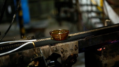 A bowl is manufactured in the factory of the French glassmaker Duralex, in La Chapelle Saint-Mesmin, central France, Wednesday, Sept. 7, 2022. Iconic French tableware brand Duralex is joining a growing array of European firms that are reducing and halting production because of soaring energy costs.