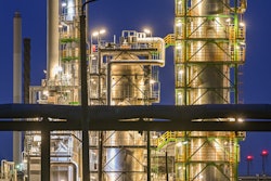 The facilities of the oil refinery on the industrial site of PCK-Raffinerie GmbH, jointly owned by Rosneft, are illuminated in the evening in Schwedt, Germany, on May 4, 2022.