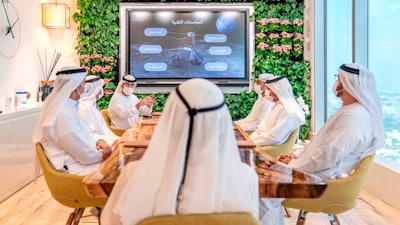 In this photo made available from the twitter account of UAE Vice President and Prime Minister and ruler of Dubai, Emirati officials brief Sheikh Mohammed bin Rashid Al Maktoum about a possible moon mission, Sept. 29, 2020, in Dubai, United Arab Emirates.