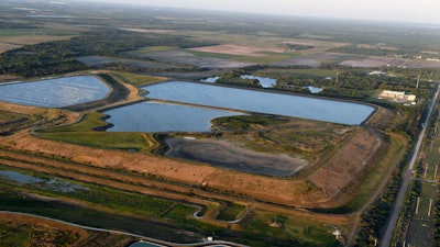 This aerial photo taken from an airplane shows a reservoir near the old Piney Point phosphate mine on April 3, 2021, in Bradenton, Fla.