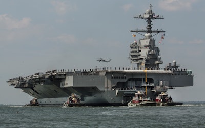 The aircraft carrier USS Gerald R. Ford heads to the Norfolk, Va., naval station on April 14, 2017.