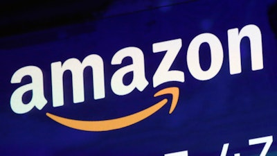 A logo for Amazon is displayed on a screen at the Nasdaq MarketSite, July 27, 2018.