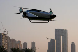 A XPeng X2, an electric flying taxi developed by the Guangzhou-based XPeng, Inc's aviation affiliate, is tested in front of the Marina District in Dubai, United Arab Emirates, Monday, Oct. 10, 2022. Monday’s demonstration was held with an empty cockpit, but the company says it carried out a manned flight test last year of the two-passenger vehicle.