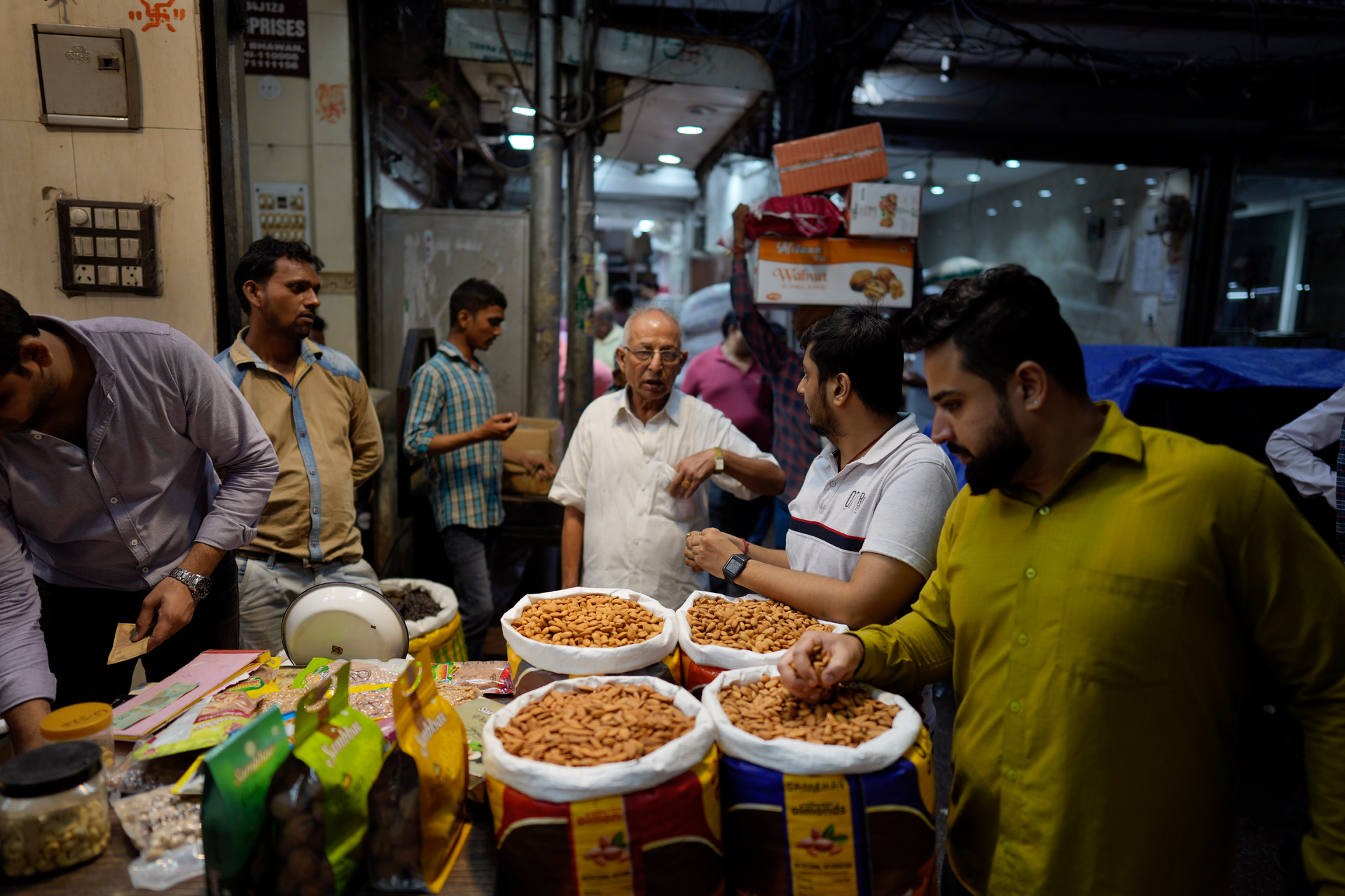 Retailers shop for dry fruits in a wholesale market, New Delhi, Oct. 10, 2022.