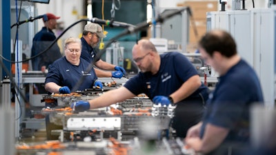 Employees work in the battery assembly hall at the BMW Spartanburg plant in Greer, S.C. Wednesday, Oct. 19, 2022.