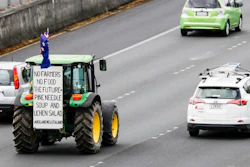 A tractor drives down the southern motorway in central Auckland, Oct. 20, 2022.