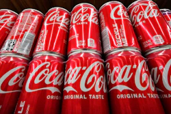 Coca-Cola cans on display at a grocery in Uniontown, Pa., April 24, 2022.