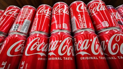 Coca-Cola cans on display at a grocery in Uniontown, Pa., April 24, 2022.