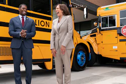 Vice President Kamala Harris, right, laughs with Environmental Protection Agency Administrator Michael Regan, during a tour of electric school buses at Meridian High School in Falls Church, Va., May 20, 2022.