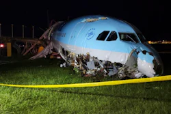 In this handout photo provided by the Civil Aviation Authority of the Philippines, a damaged portion of the Korean Air Lines Co. plane lies after it overshot the runway at the Mactan Cebu International Airport in Cebu, central Philippines, on Monday, Oct. 24, 2022. A Korean Air Lines Co. plane carrying 173 passengers and crew members overshot a runway while landing in bad weather in the central Philippines late Sunday and authorities said all those on board were safe. The airport is temporarily closed due to the stalled aircraft.