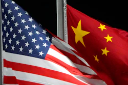 The American and Chinese flags wave at Genting Snow Park ahead of the 2022 Winter Olympics, Feb. 2, 2022, in Zhangjiakou, China. The Commerce Department is tightening export controls to limit China’s ability to get advanced computing chips, develop and maintain supercomputers, and make advanced semiconductors.