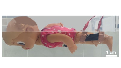 An underwater movement sensor attached to a motorized swimming doll’s knee alerts a smartphone app when the doll stops kicking, simulating a swimmer in distress.