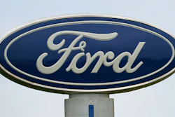 A Ford logo is seen on signage at Country Ford in Graham, N.C., on July 27, 2021.
