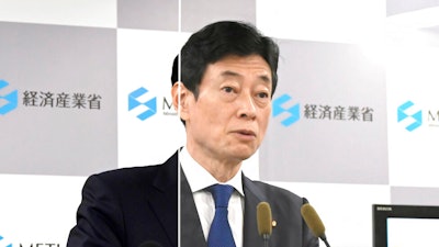 Yasutoshi Nishimura, Minister of Economy of Japan, speaks during a press conference at the ministry in Tokyo, Friday, Nov. 11, 2022. Japan is investing almost half a billion dollars to beef up semiconductor development and production in a “last chance” attempt to keep its position as a major player on the global technology stage, the government said Friday.