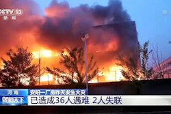 In this image taken from video footage run by China's CCTV, an industrial wholesaler burns in Anyang in central China's Henan province, Monday, Nov. 21, 2022.