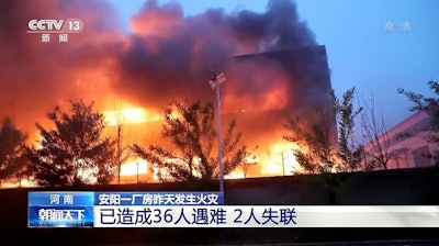 In this image taken from video footage run by China's CCTV, an industrial wholesaler burns in Anyang in central China's Henan province, Monday, Nov. 21, 2022.