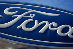This Oct. 24, 2021 file photo shows a Ford company logo on a sign at a Ford dealership in southeast Denver.
