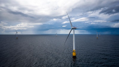 Hywind Scotland, the world's first commercial wind farm using floating wind turbines, is visible off the coast of Scotland in August 2017.
