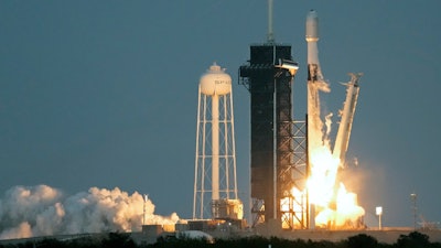 A SpaceX Falcon 9 rocket, with a payload of 40 satellites for OneWeb broadband communications, lifts off from pad 39A at the Kennedy Space Center in Cape Canaveral, Fla., Thursday, Dec. 8, 2022.