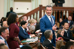 California Gov. Gavin Newsom walks through the assembly chamber with California Controller Malia Cohen during the opening session of the California Legislature in Sacramento, Calif., Monday, Dec. 5, 2022. The legislature returned to work on Monday to swear in new members and elect leaders for the upcoming session.
