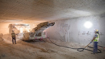 This undated file image provided by the U.S. Department of Energy shows an electric continuous miner machine run by Randy Wilson, left, and Blas Castaneda, chewing through a wall of salt during the excavation of Panel 8 at the Waste Isolation Pilot Plant near Carlsbad, N.M. On Thursday, Dec. 8, 2022, New Mexico officials outlined new conditions for a proposed permit for the U.S. government to continue disposing of nuclear waste in the southeast corner of the state as part of a multibillion-dollar federal cleanup program.