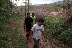 Residents of the Puerto Franco community walk near the limit of Cordillera Azul National Park in Peru's Amazon, Monday, Oct. 3, 2022.