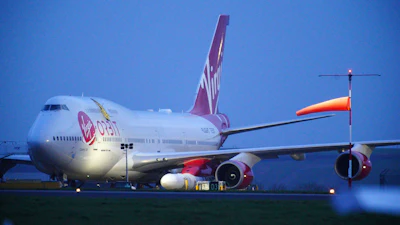 Virgin Atlantic Cosmic Girl, a repurposed Virgin Atlantic Boeing 747 aircraft carrying a rocket, is parked at Spaceport Cornwall, at Cornwall Airport in Newquay, England, Monday, Jan. 9, 2023.
