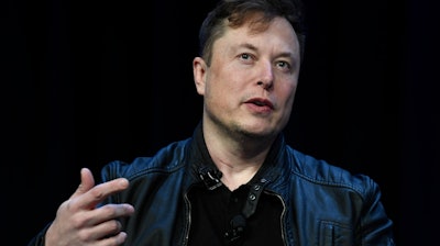 Tesla and SpaceX Chief Executive Officer Elon Musk speaks at the SATELLITE Conference and Exhibition on March 9, 2020, in Washington. Lawyers for Tesla shareholders suing Musk over a misleading tweet are urging a federal judge to reject the billionaire's request to move an upcoming trial to Texas from California.