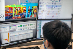 A worker uses a computer terminal to monitor remote operations at a container port in Tianjin, China, on Jan. 16, 2023.