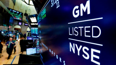 In this April 23, 2018, file photo, the logo for General Motors appears above a trading post on the floor of the New York Stock Exchange.