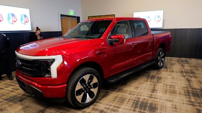 The Ford F-150 Lightning is displayed at the M1 Concourse car club, Wednesday, Jan. 11, 2023, in Pontiac, Mich. The vehicle won the 2023 North American Truck of the Year during an awards ceremony Wednesday.