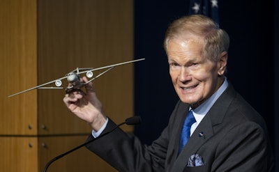 NASA Administrator Bill Nelson holds a model of an aircraft with a Transonic Truss-Braced Wing during a news conference on NASA's Sustainable Flight Demonstrator project, Wednesday, Jan. 18, 2023, at the Mary W. Jackson NASA Headquarters building in Washington, DC.