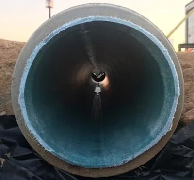 The blue cured-in-place pipe, or CIPP, can be seen inside this damaged storm sewer pipe. The CIPP was created by steam cooking the resin into the hard plastic.